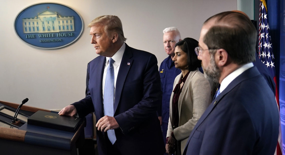 President Trump arrives to speak at a news briefing with the coronavirus task force on Monday in the White House press briefing room. Evan Vucci/AP