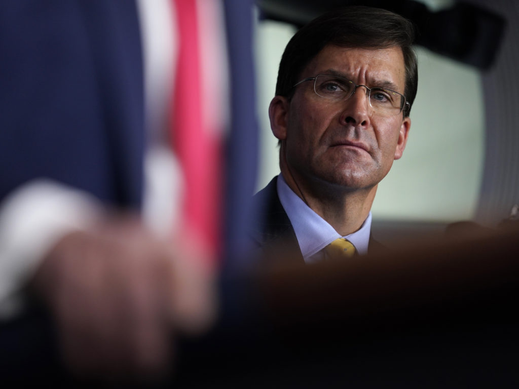 Defense Secretary Mark Esper listens as President Trump speaks during a news briefing with the Coronavirus Task Force at the White House on last week. CREDIT: Evan Vucci/AP