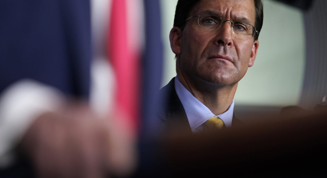 Defense Secretary Mark Esper listens as President Trump speaks during a news briefing with the Coronavirus Task Force at the White House on last week. CREDIT: Evan Vucci/AP