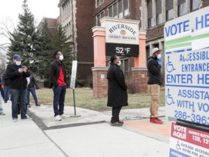 Voters line up at Riverside High School for Wisconsin's primary election on April 7 in Milwaukee, amid concerns about the spread of the coronavirus. CREDIT: Morry Gash/AP