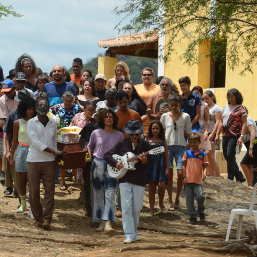 Mourners gather for a heartfelt burial ceremony in the Brazilian film Bacurau. Victor Juc /Kino Lorber