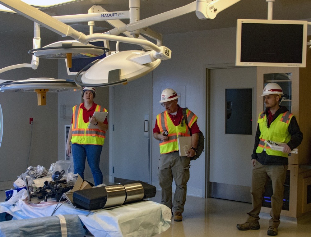 U.S. Army Corps of Engineers, Seattle District Assessment Team members, from left, Bridget Bentley, Joe Marsh and Jon Springer inspect an operating room during an inspection at the former Astria Regional Medical Center in Yakima on April 1, 2020. CREDIT: William Dowell/US Army Corps of Engineers