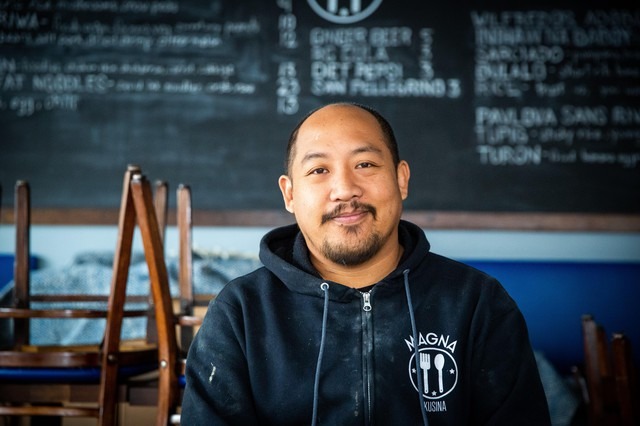 Carlo Lamagna, the owner and chef of Magna Kusina in Portland, Ore., poses for a portrait inside his closed restaurant on Friday, March 27, 2020. Lamagna laid off his entire staff and closed the business following Oregon Gov. Kate Brown’s order to halt dine-in eating at restaurants in response to the coronavirus outbreak. CREDIT: Bryan M. Vance/OPB