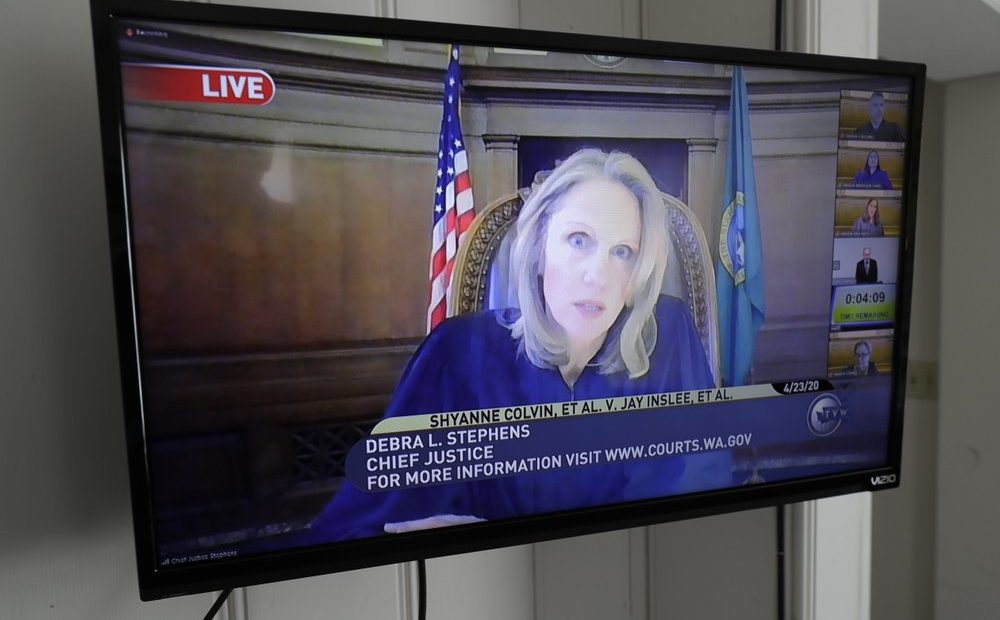 Debra Stephens, Chief Justice of the Washington state Supreme Court, appears on a TV livestream of court proceedings, April 23, 2020, as the Court hears oral arguments in a case that addressed the safety of prison inmates during the coronavirus outbreak.