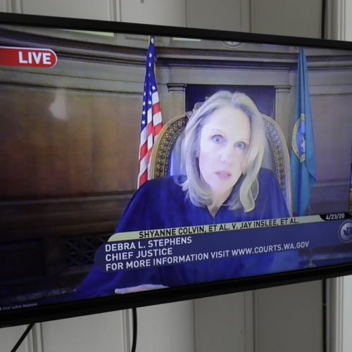 Debra Stephens, Chief Justice of the Washington state Supreme Court, appears on a TV livestream of court proceedings, April 23, 2020, as the Court hears oral arguments in a case that addressed the safety of prison inmates during the coronavirus outbreak.