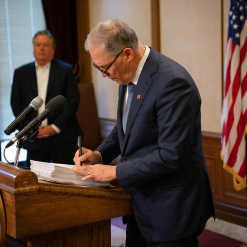 Gov. Jay Inslee signs Washington's supplemental operating budget into law on April 3, 2020. Before doing so, he vetoed more than $200 million in new spending in anticipation of the fiscal impacts of the COVID-19 pandemic. CREDIT: Office of the Governor