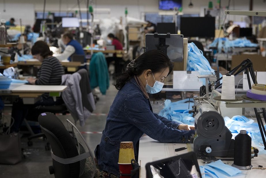 Kaas Tailored employees sew masks on Monday, March 23, 2020, at the Kaas Tailored furniture factory in Mukilteo. CREDIT: Megan Farmer/KUOW