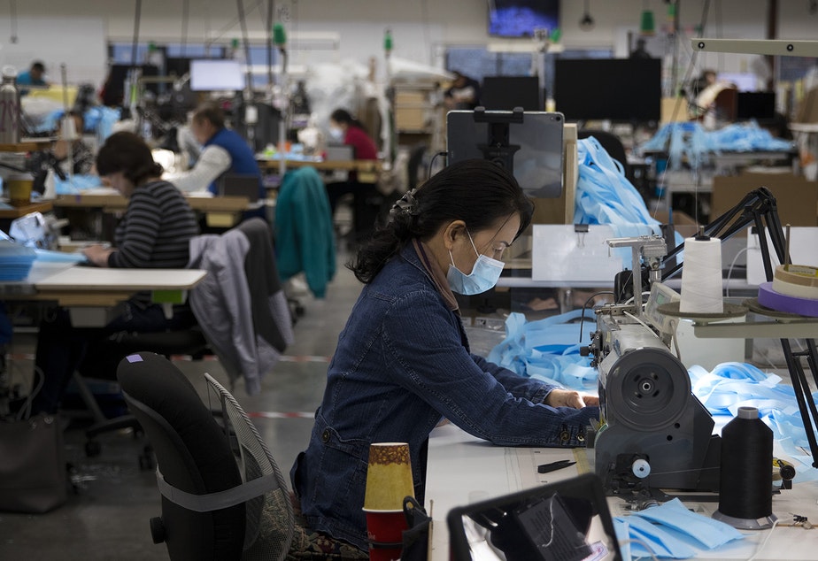 Kaas Tailored employees sew masks on Monday, March 23, 2020, at the Kaas Tailored furniture factory in Mukilteo. CREDIT: Megan Farmer/KUOW