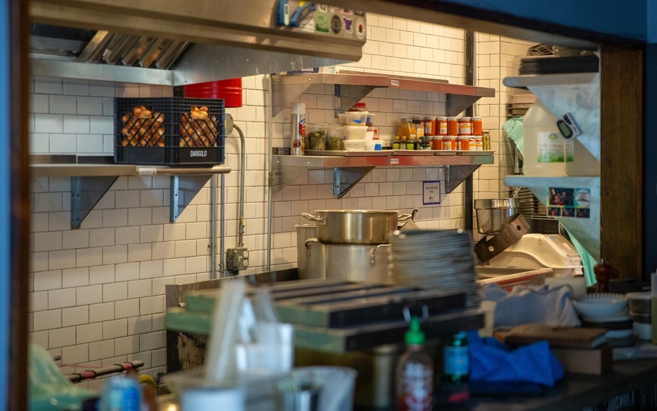 The kitchen of Magna Kusina sits empty in Portland, Ore., on Friday, March 27, 2020. Owner and chef Carlo Lamagna laid off his entire staff and closed the restaurant following Oregon Gov. Kate Brown's order to halt dine-in eating at restaurants in response to the coronavirus outbreak. CREDIT: Bryan M. Vance/OPB