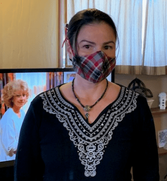 Psychiatric social worker Maria Claudio shows off one of the homemade masks she's made for herself and co-workers at Western State Hospital.