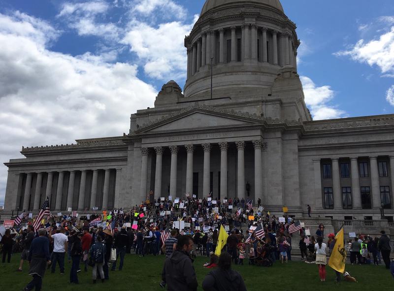 On Sunday, crowds gathered at the Washington Capitol in defiance of and in opposition to Gov. Jay Inslee's COVID-19 orders restricting crowd sizes, shuttering businesses and requiring people to stay home.