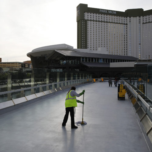 A worker cleans along the Las Vegas Strip, which is nearly empty without the usual crowds as casinos and other businesses are shuttered during the coronavirus outbreak on March 31. John Locher/AP