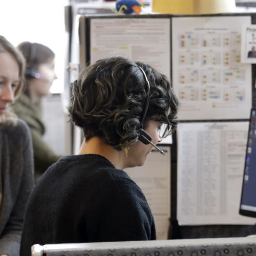 Washington says it will launch contact tracing teams to map coronavirus exposure. Here, public health nurse Jennifer Morgan, right, checks-in via phone with a patient self-quarantined at home in February. University of Washington epidemiology student Erika Feutz observes in Seattle. CREDIT: Elaine Thompson/AP