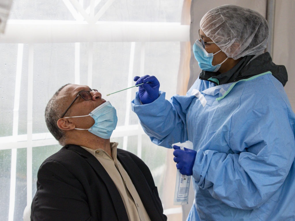 Indiana gubernatorial candidate Dr. Woody Myers takes a COVID-19 test at Aria Diagnostics in Indianapolis. CREDIT: Michael Conroy/AP