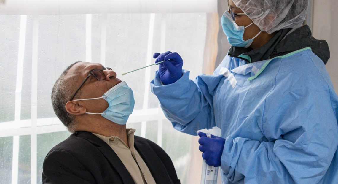 Indiana gubernatorial candidate Dr. Woody Myers takes a COVID-19 test at Aria Diagnostics in Indianapolis. CREDIT: Michael Conroy/AP