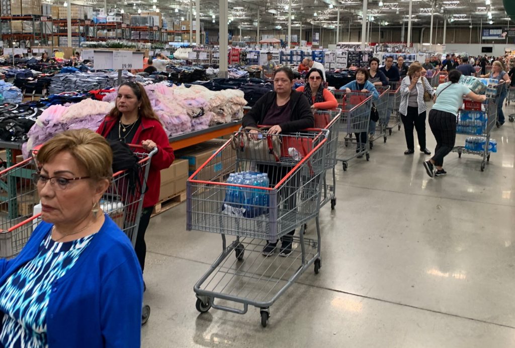 Customers line up to buy water and other supplies in Burbank, Calif., on March 6 in reaction to fears that the novel coronavirus would spread and force people to stay indoors. Robyn Beck/AFP via Getty Images
