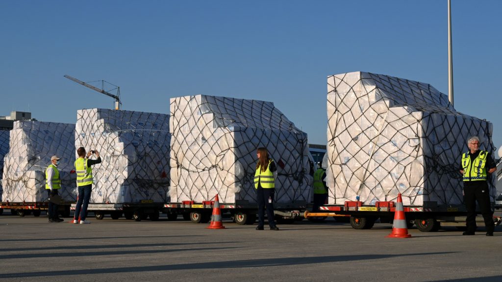 Batches of 8 million protective masks are unloaded from a Lufthansa airplane at the Franz Josef Strauss airport in Munich on Tuesday after arriving from Shanghai. Christof Stache/AFP via Getty Images