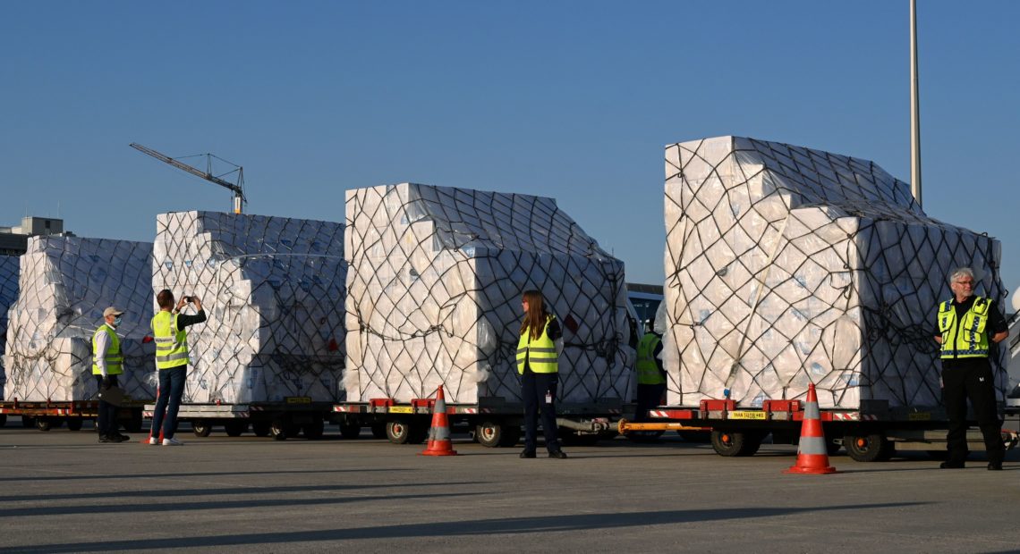 Batches of 8 million protective masks are unloaded from a Lufthansa airplane at the Franz Josef Strauss airport in Munich on Tuesday after arriving from Shanghai. Christof Stache/AFP via Getty Images
