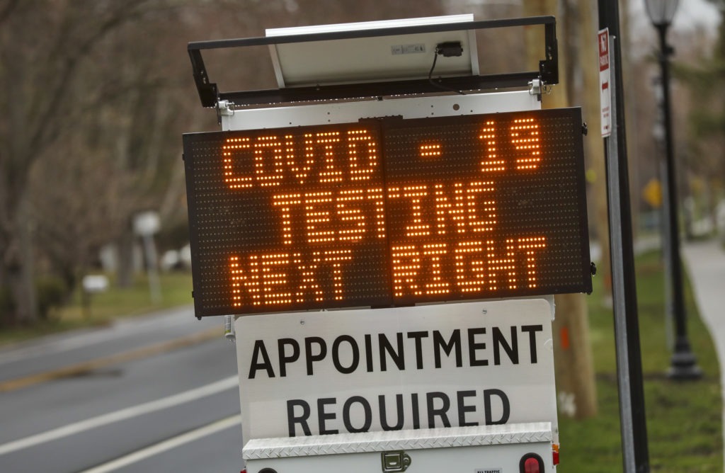 A digital sign on March 28 directs patients to the drive-through coronavirus test site at Stony Brook University in New York. John Paraskevas/Newsday via Getty Images