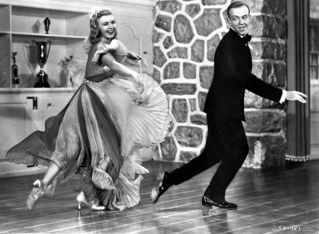 Fred Astaire and Ginger Rogers gave Americans a much-needed on-screen escape in the 1930s. Above, they dance in the 1938 comedy musical Carefree. Hulton Archive/Getty Images