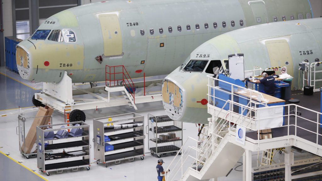 Employees work on Airbus SE A321 fuselages at the company's final assembly line facility in Mobile, Ala. in 2017. CREDIT: Bloomberg/Bloomberg via Getty Images