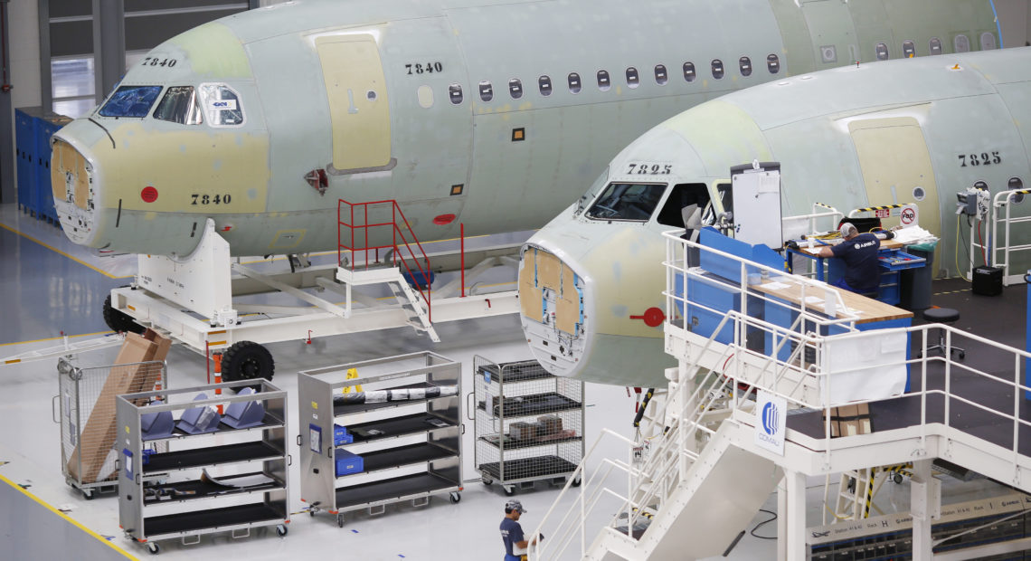 Employees work on Airbus SE A321 fuselages at the company's final assembly line facility in Mobile, Ala. in 2017. CREDIT: Bloomberg/Bloomberg via Getty Images