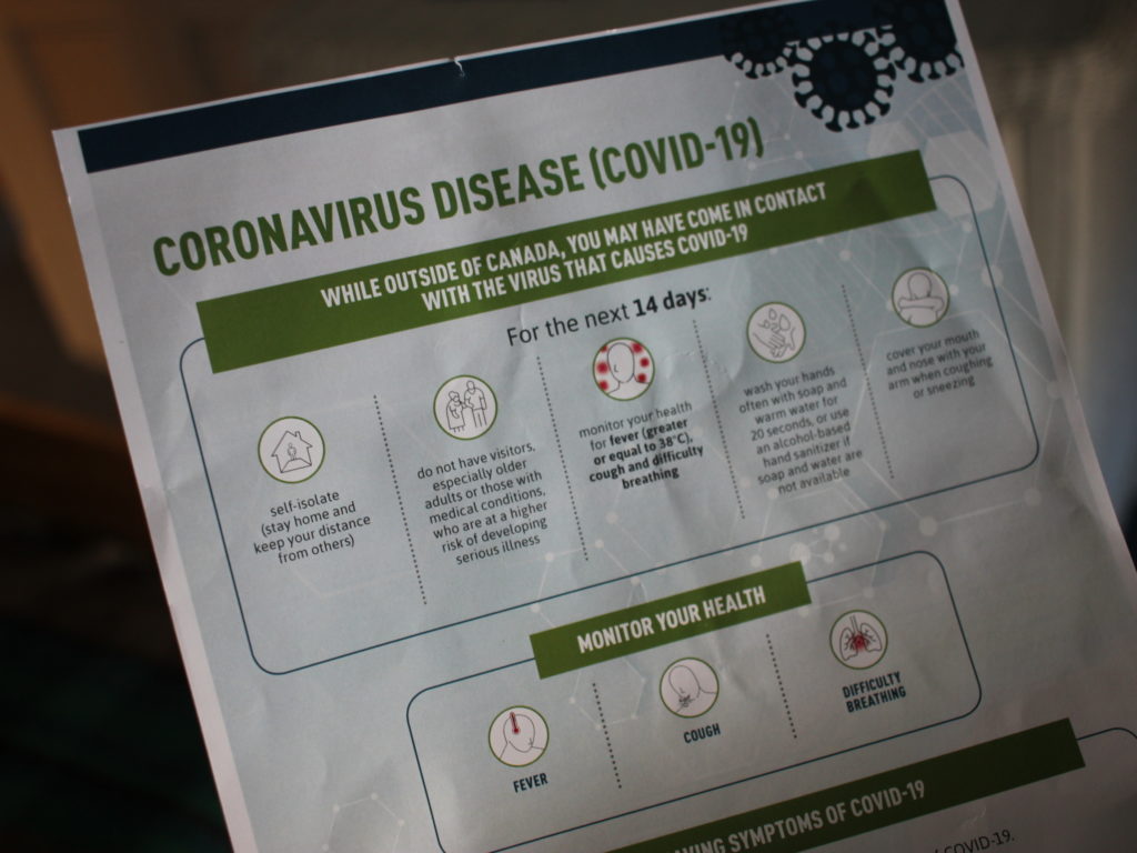 Canadian border agents are handing people entering Canada a sheet from the Public Health Agency of Canada that instructs them to self-quarantine for 14 days and monitor themselves for any symptoms that might signal COVID-19. Selena Simmons-Duffin/NPR