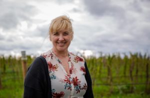 Michelle Krummenacker, whose family has owned and operated Liepold Farms since the 1950s, poses for a portrait in front of some of the farm’s raspberries in Boring, Ore.