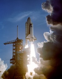 The first orbital mission of the space shuttle lifts off from the Kennedy Space Center on April 12, 1981.