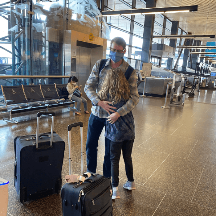Dr. Luke Hansen says goodbye to his nine-year-old daughter before boarding a plane to New York City in early April to volunteer his services at Elmhurst Hospital during the height of the COVID-19 outbreak.