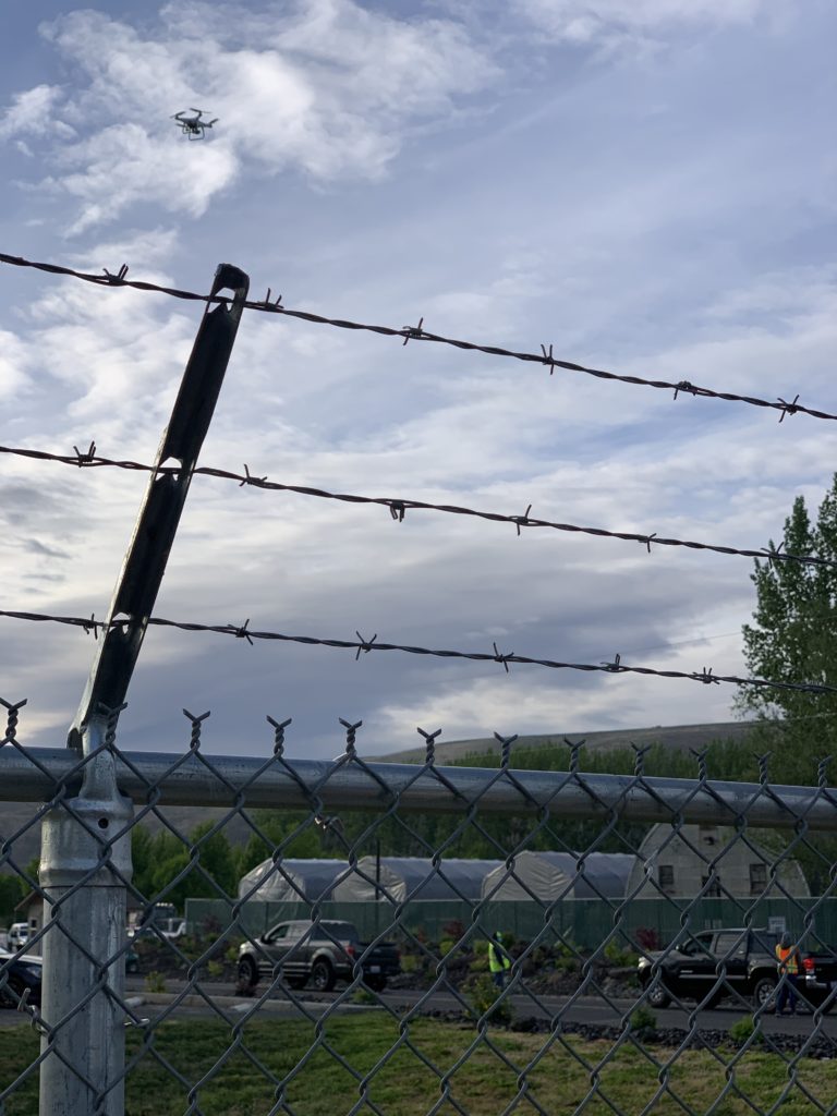 A drone flies over Monson Fruit property while workers walk out on strike on May 13. CREDIT: Enrique Pérez de la Rosa/NWPB