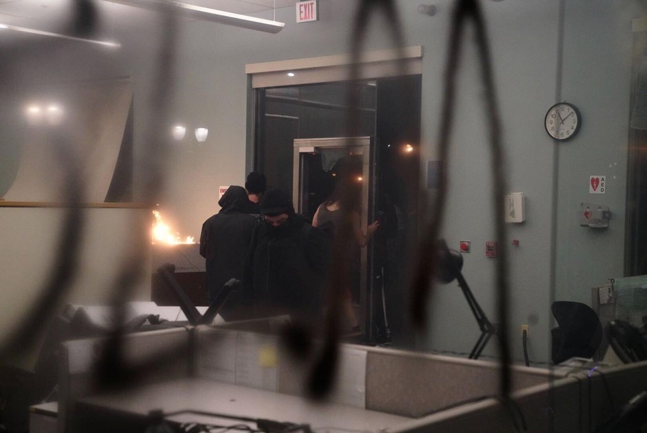 Demonstrators broke into and set a small fire in the Multnomah County Justice Center in downtown Portland, Ore., Friday, May 29, 2020. CREDIT: Jonathan Levinson/OPB