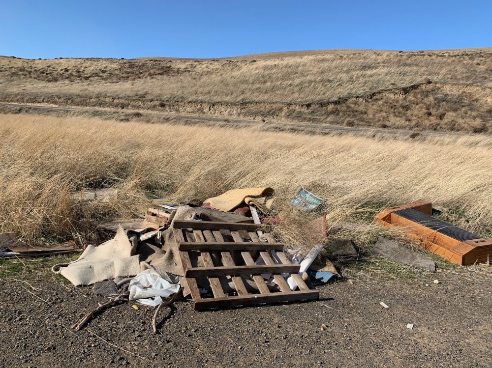 Cyclists found a pile of trash near the roadside south of Kennewick. Cyclist Mike Robinson says he’s seen more trash dumped by the edge of the road since the pandemic started. Courtesy of Mike Robinson