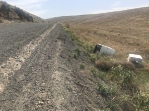 A washing machine was abandoned on the side of the road outside Kennewick. The Washington State Department of Transportation has noticed an uptick in appliances and other junk that’s illegally dumped. (Credit: Courtney Flatt / Northwest News Network)