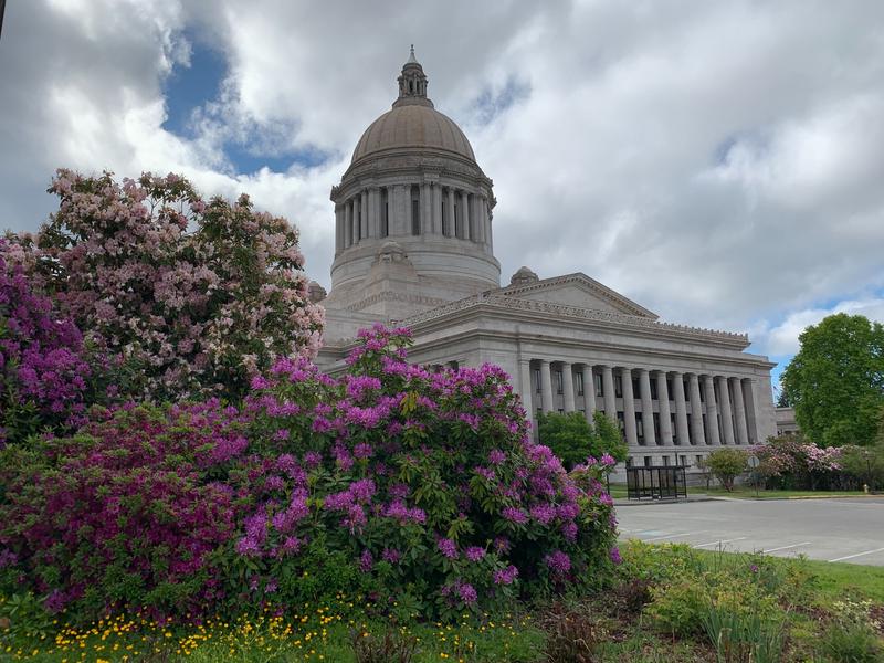 The Washington Capitol building in Olympia with flowers in front
