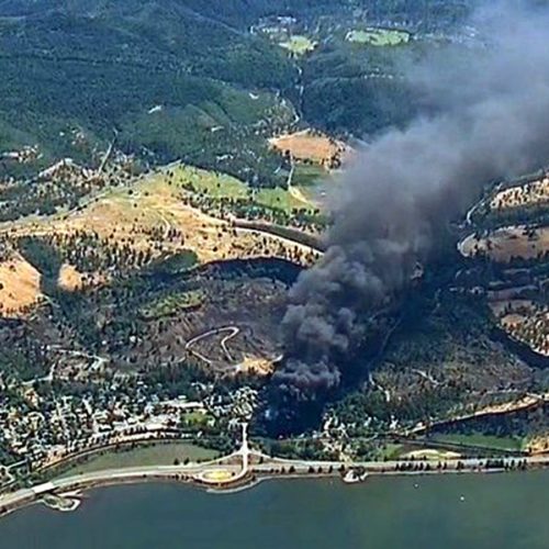 Smoke billows from a Union Pacific train that derailed near Mosier, Ore., in the Columbia River Gorge. on June 3, 2016.