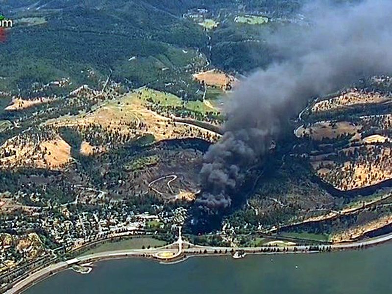 Smoke billows from a Union Pacific train that derailed near Mosier, Ore., in the Columbia River Gorge. on June 3, 2016.