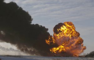 A fireball goes up at the site of an oil train derailment near Casselton, N.D. on Dec. 30, 2013.