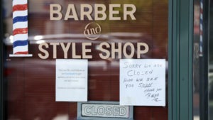 A Seattle barbershop remains closed because of the coronavirus outbreak on May 19. Last week, an additional 2.1 million people filed for unemployment benefits around the country.