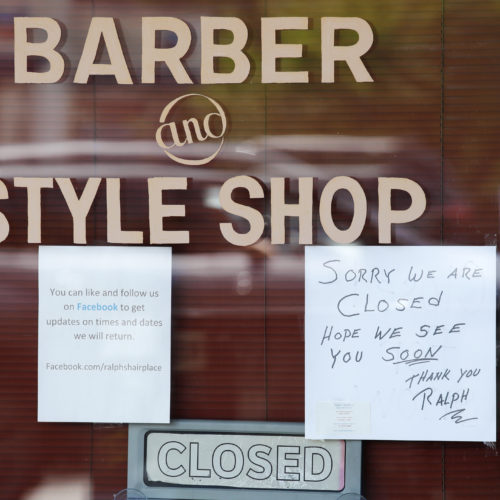 A Seattle barbershop remains closed because of the coronavirus outbreak on May 19. Last week, an additional 2.1 million people filed for unemployment benefits around the country.