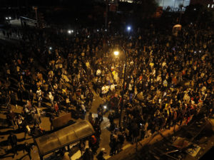 One perspective on Thursday night: the crowd of protesters, as seen from the roof of the 3rd Precinct. Some later stormed the building, which was abandoned by officers, and set fire to the structure and other buildings in the neighborhood. 