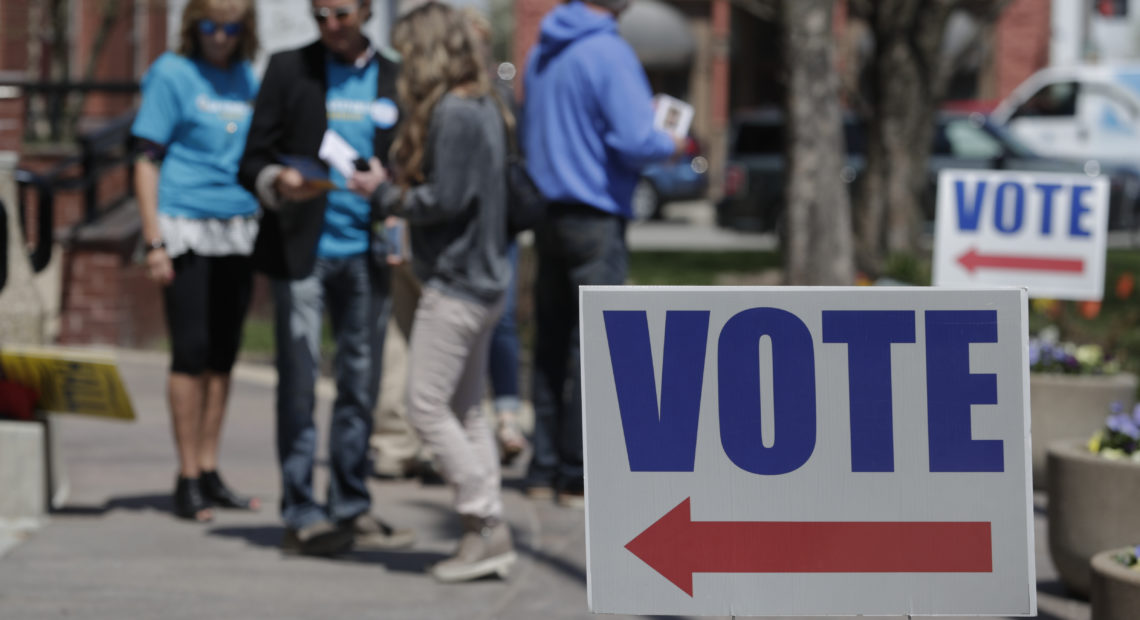 Electioneers greet voters outside the Hamilton County Government Center