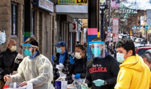 People line up in mid-April in Chelsea, Mass., to get antibody tests for the coronavirus that causes COVID-19. 