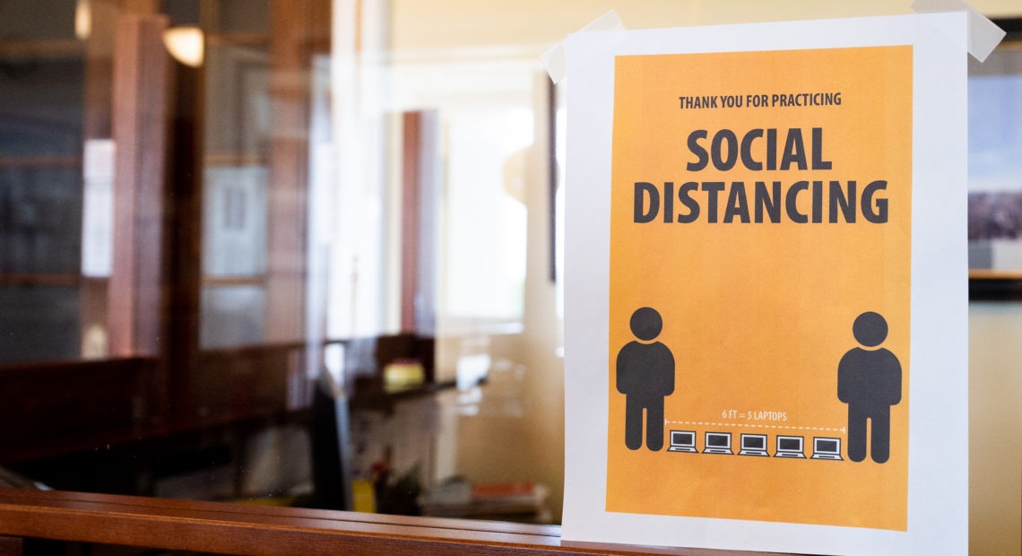 A coronavirus awareness sign around the U.S. Capitol encourages social distancing