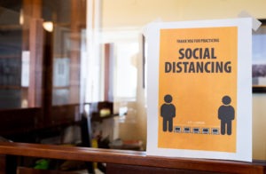 A coronavirus awareness sign around the U.S. Capitol encourages social distancing