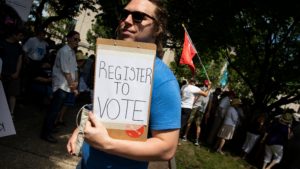 A voter registration volunteer in Philadelphia in 2018. New registrations had surged going into 2020 but have dropped off dramatically as a result of the coronavirus pandemic.