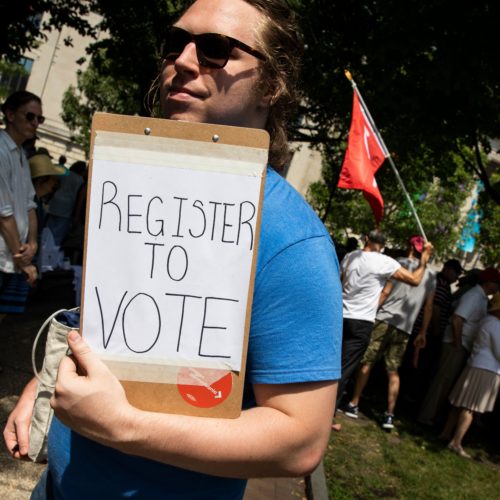 A voter registration volunteer in Philadelphia in 2018. New registrations had surged going into 2020 but have dropped off dramatically as a result of the coronavirus pandemic.