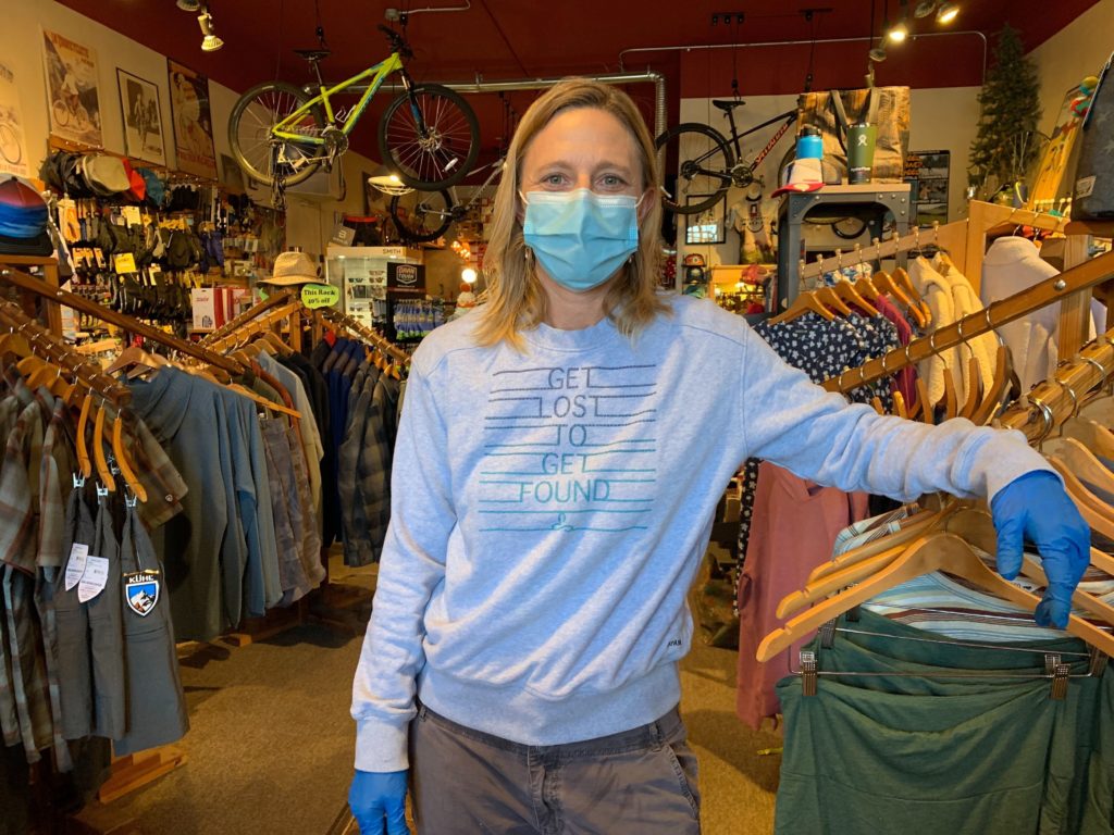 Melissa Alder, co-owner of Freeheel and Wheel in West Yellowstone, is worried that the park reopening could bring a spike in coronavirus cases. CREDIT: Kirk Siegler/NPR