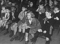 New York City children attend a show by the Marionette Unit of the WPA's Federal Theatre Project puppet show in 1935. CREDIT: Franklin D. Roosevelt Library / National Archives