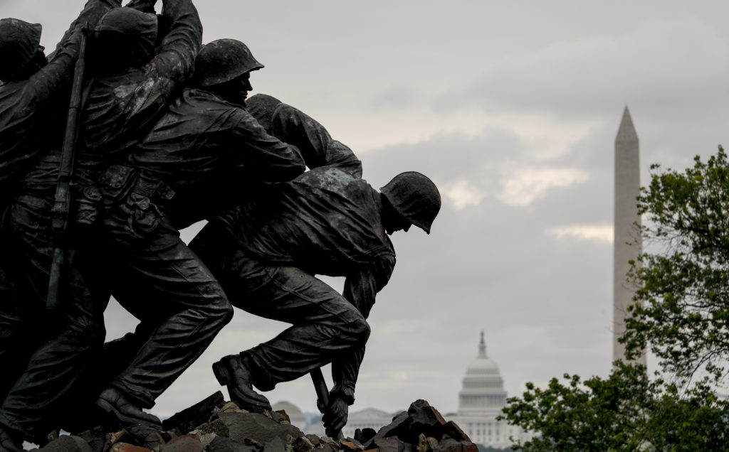 The Washington Monument and the dome of the U.S. Capitol Building are visible behind the U.S. Marine Corps War Memorial in Arlington, Va., on Memorial Day. CREDIT: Andrew Harnik/AP